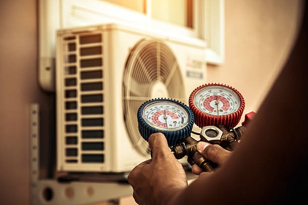 Professional Air Conditioning Service technician working in Harris, IA